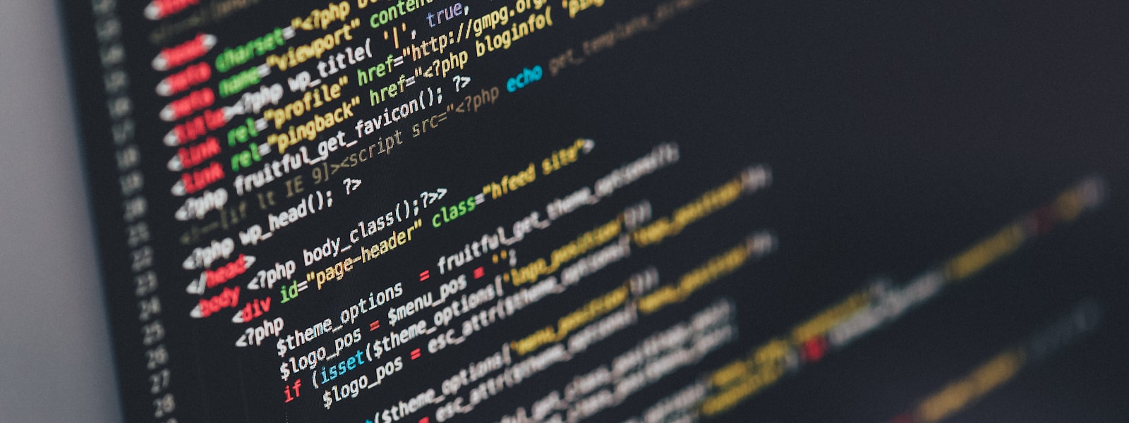 Developer writing code on a laptop